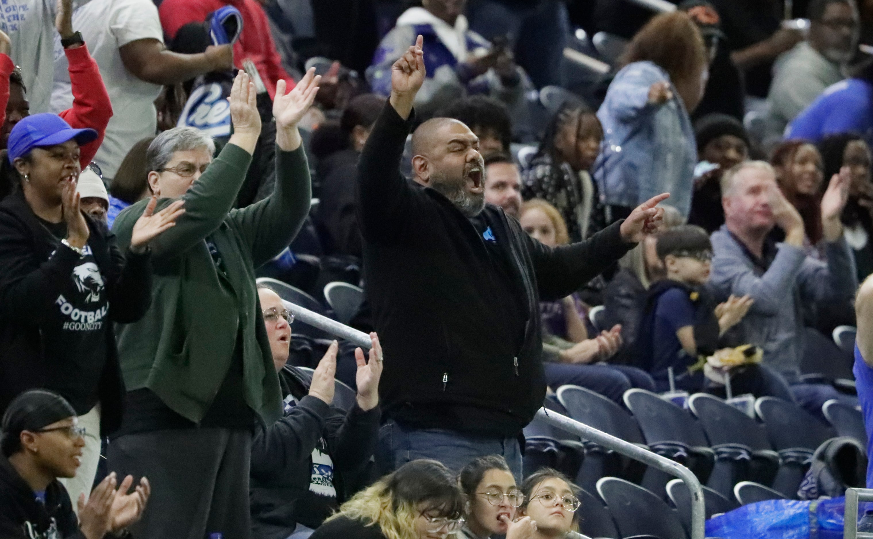 North Crowley High School fans celebrate the first touchdown of the game during the first...