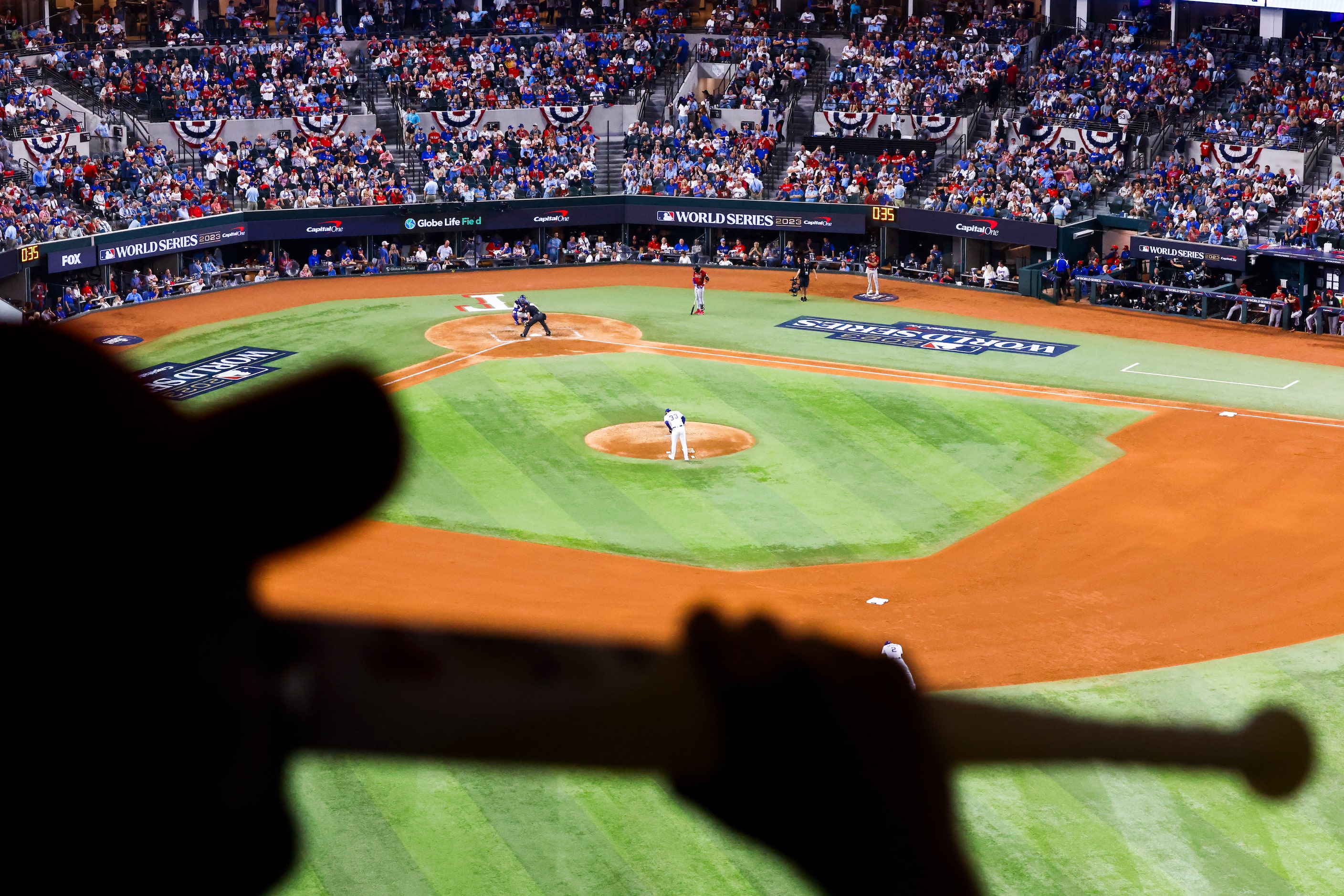 Allon Hall is silhouetted as Texas Rangers pitcher Dane Dunning  takes the during the fifth...