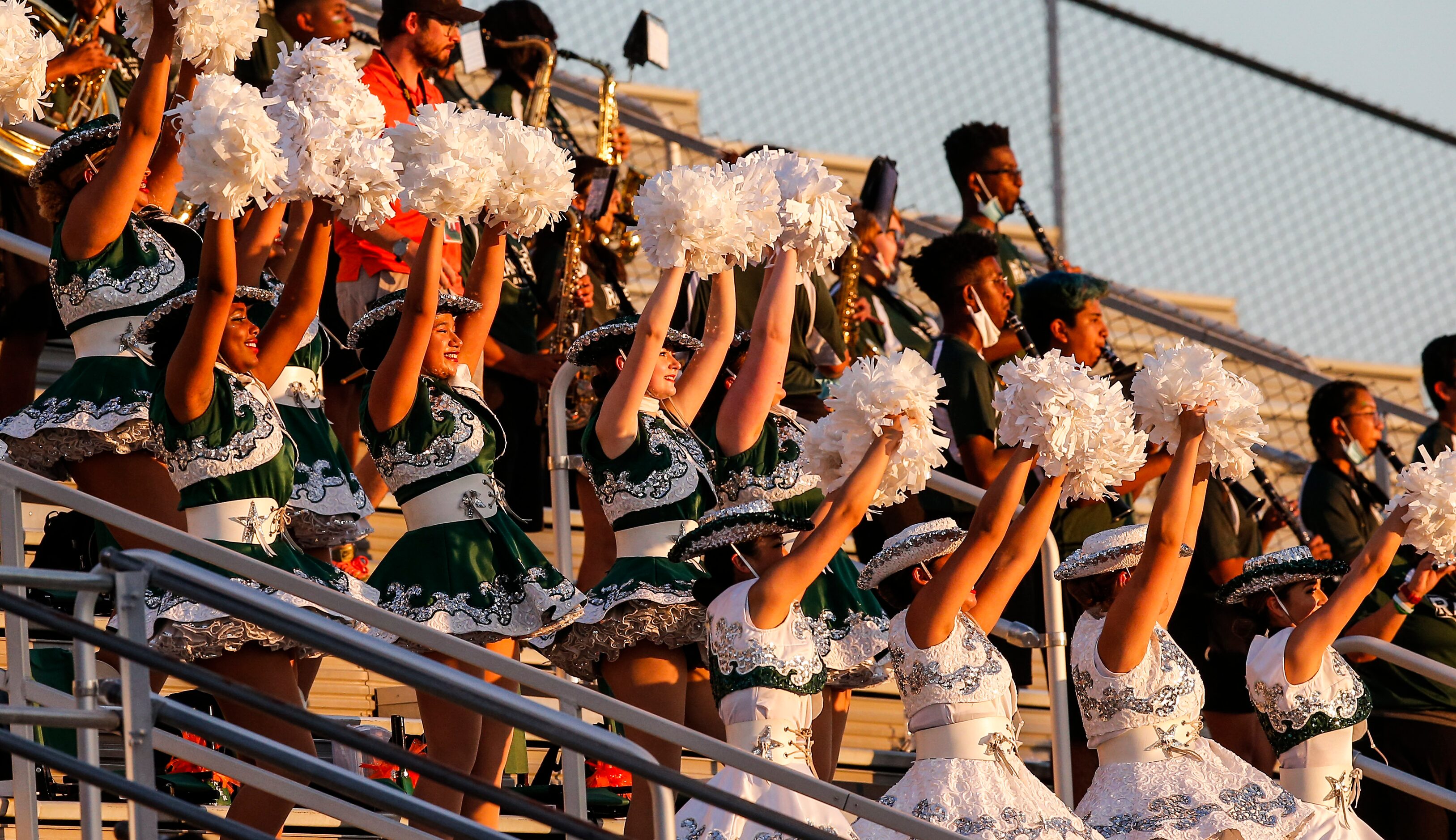 Garland Naaman Forest’s drill team performs during a high school football game against North...