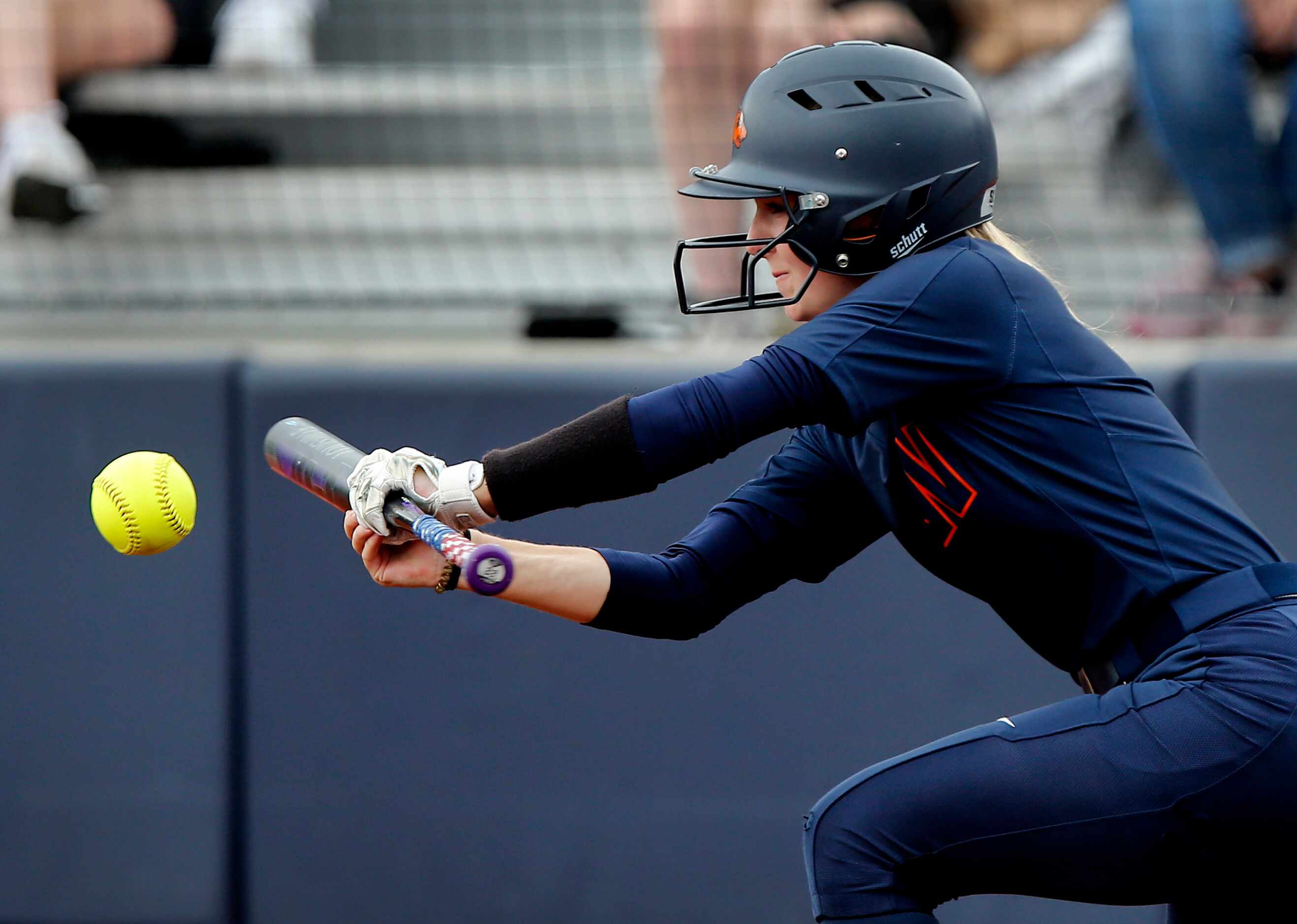 Wakeland center fielder Kate Ellis (6) lays down a bunt in the fifth inning as Lovejoy High...