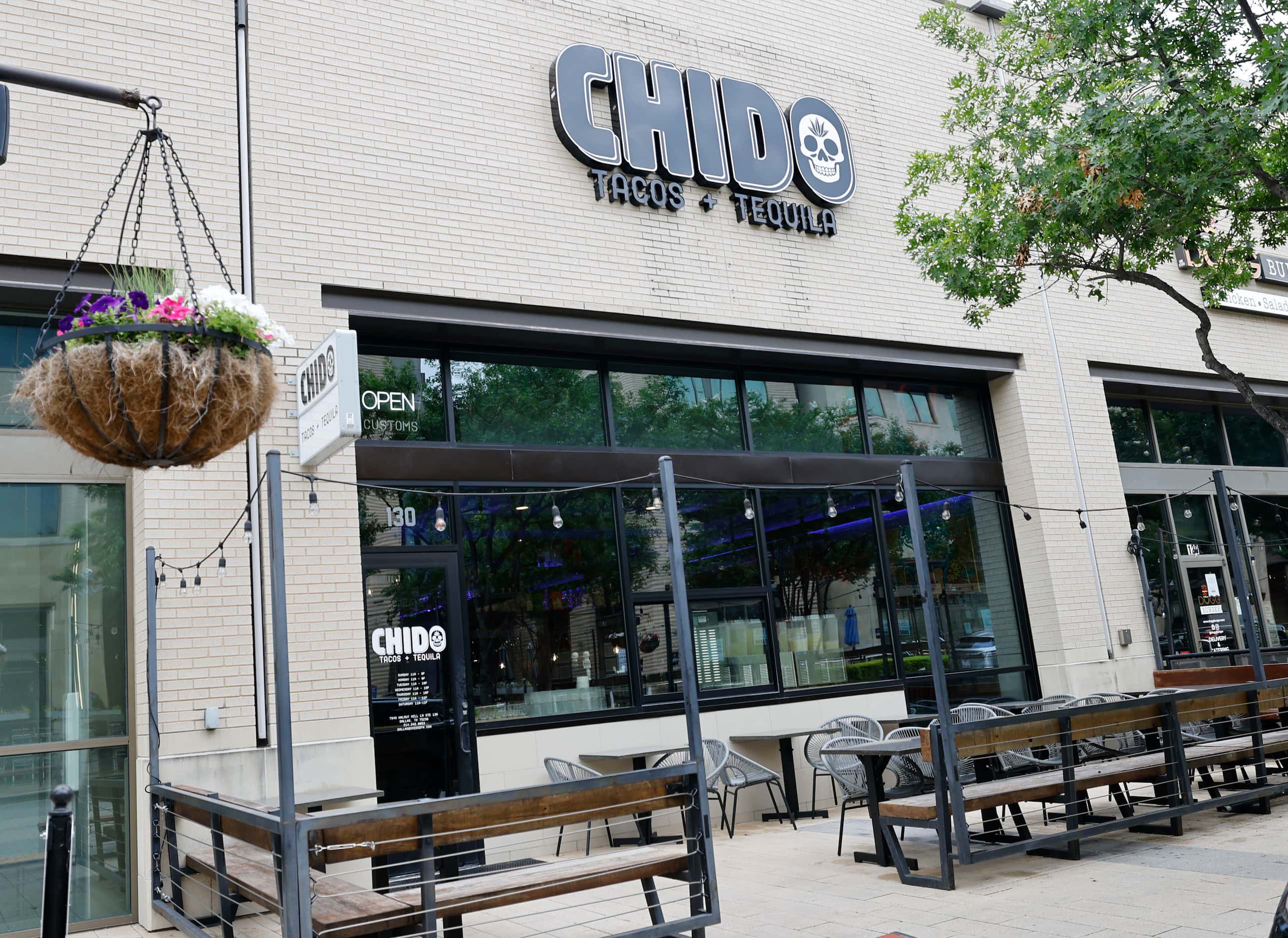 The exterior of Chido Tacos and Tequila is seen in Preston Hollow Village. Trader Joe's is...