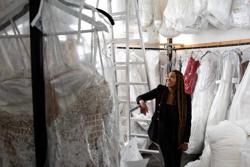 Esé Azénabor Grembowski, owner and creative director of Esé Azénabor, looks at her dresses...