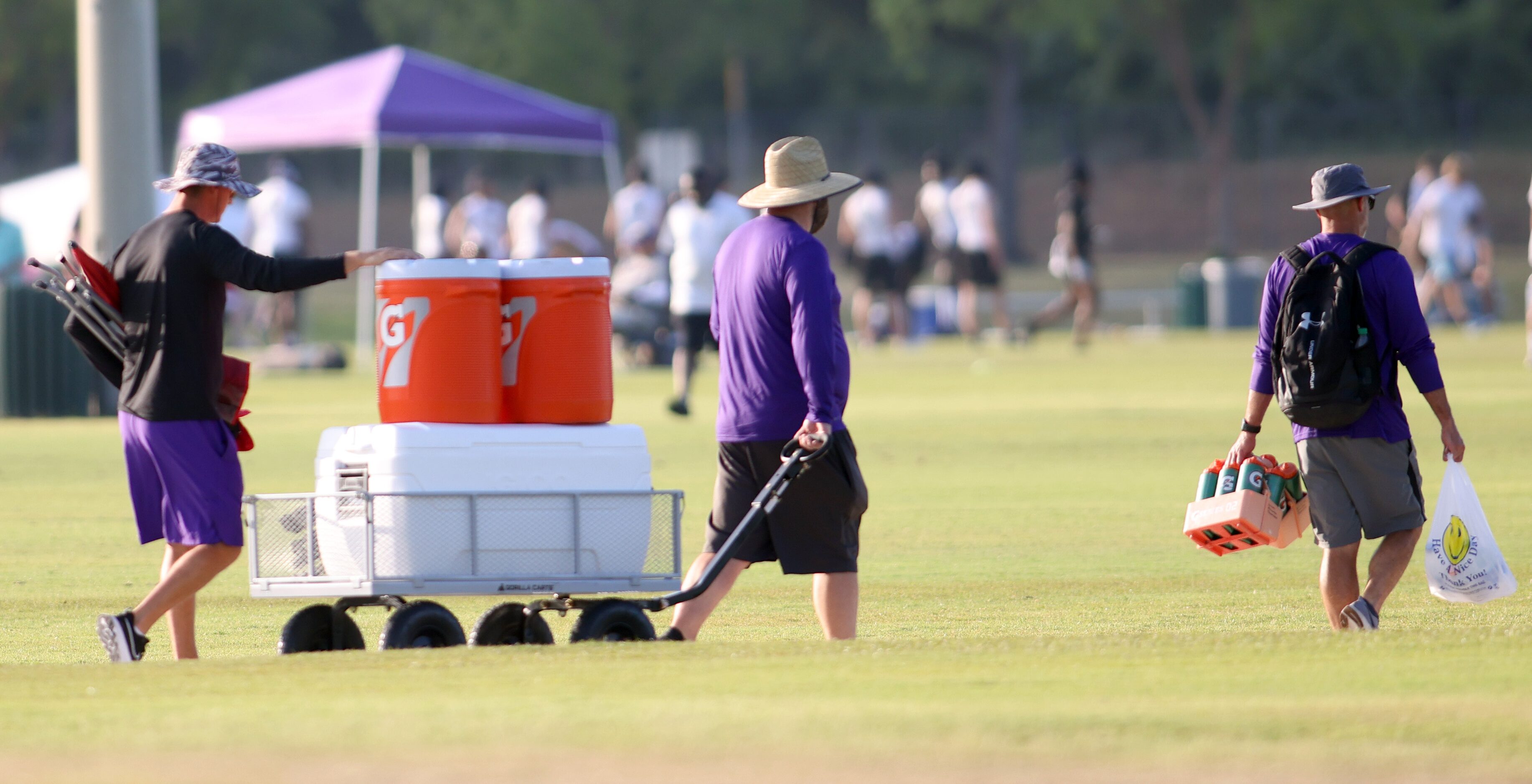 Football enthusiasts are armed with ice, sports drinks and shade protection in their quest...