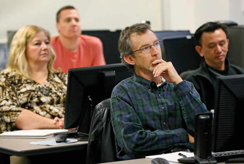 
Larry Jones (center), a marine veteran, listens to his instructor. Collin College is one of...