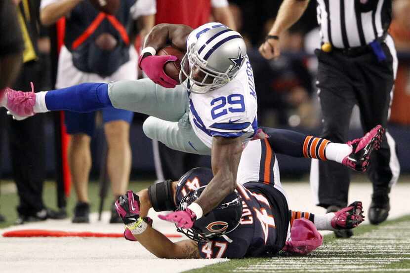 Dallas Cowboys running back DeMarco Murray (29) is pushed out of bounds by Chicago Bears...
