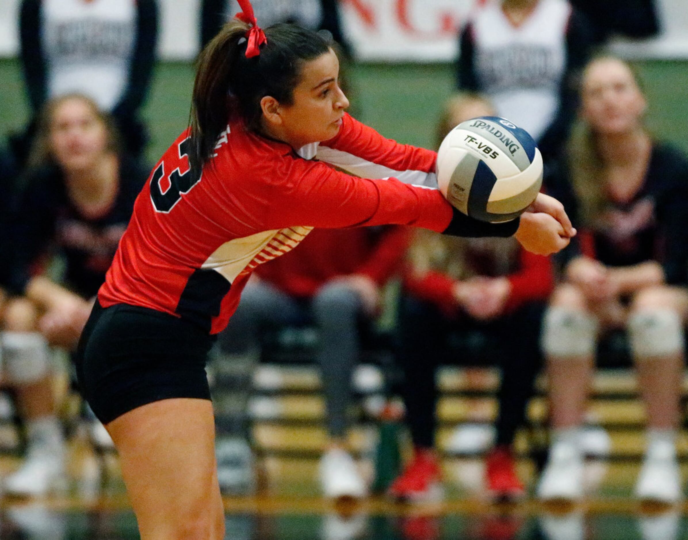 Lovejoy High School defensive specialist Callie Kemohah (3) passes a serve in game one as...