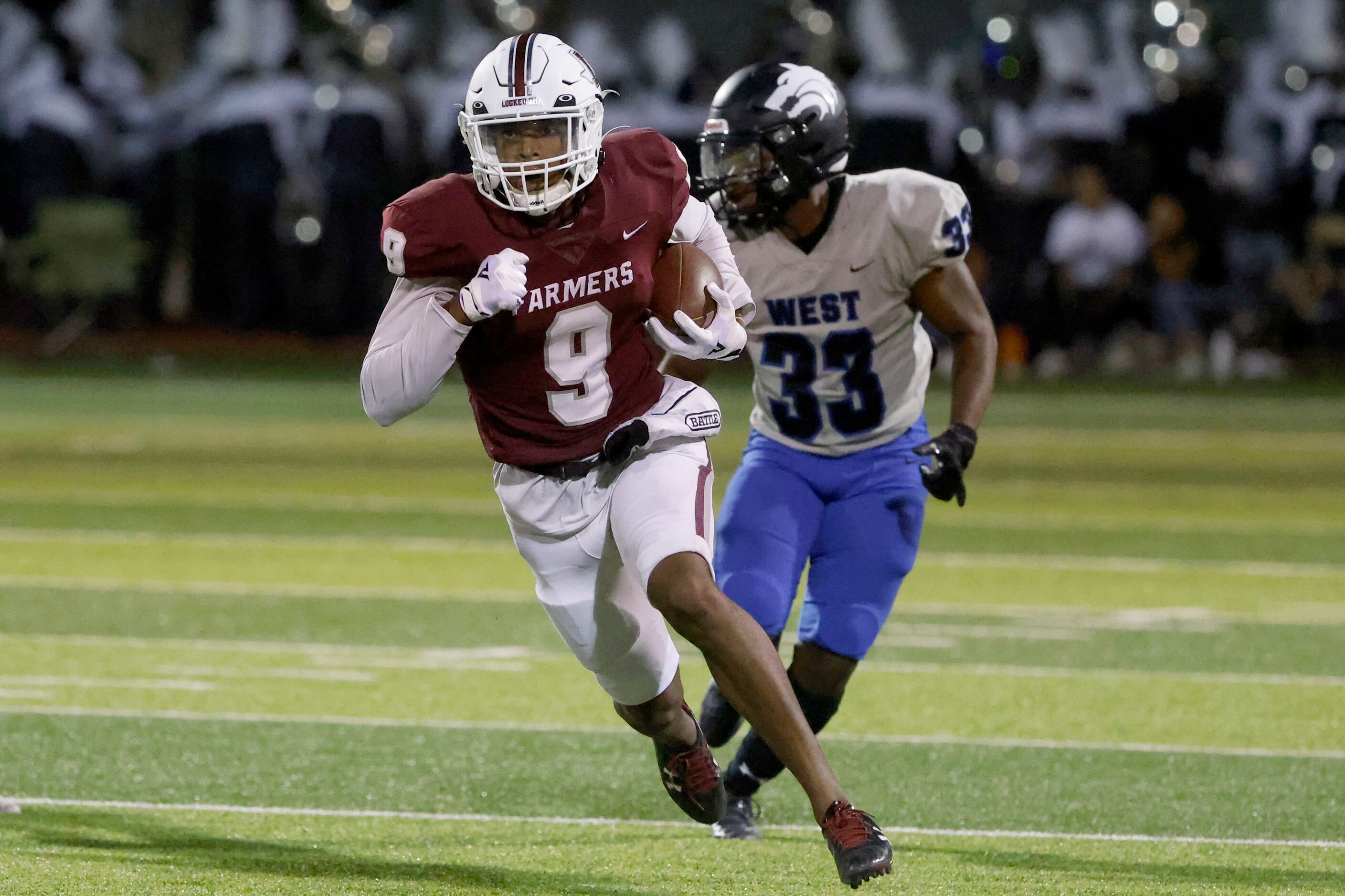 Lewisville receiver Amani Winfeild (9) runs past Plano West defender Johnnie Ingram (33O as...