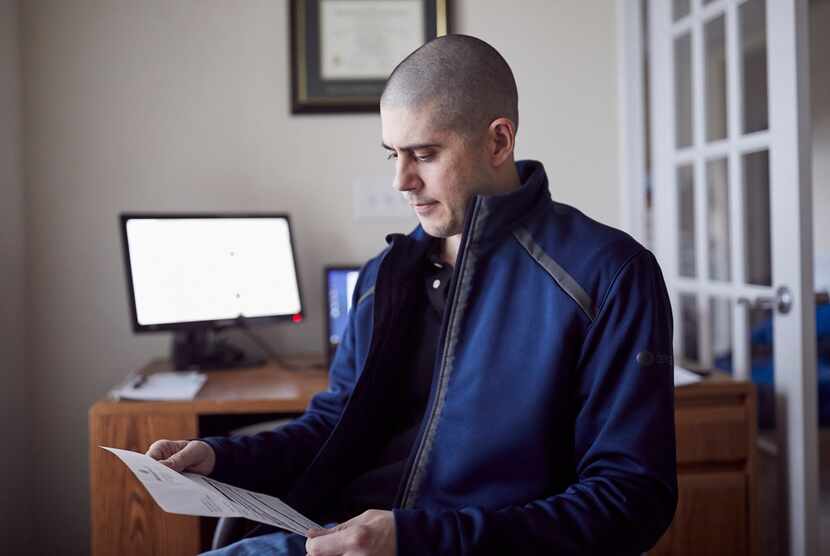 Matt Gleason looks over a bill he received from Atrium Health.