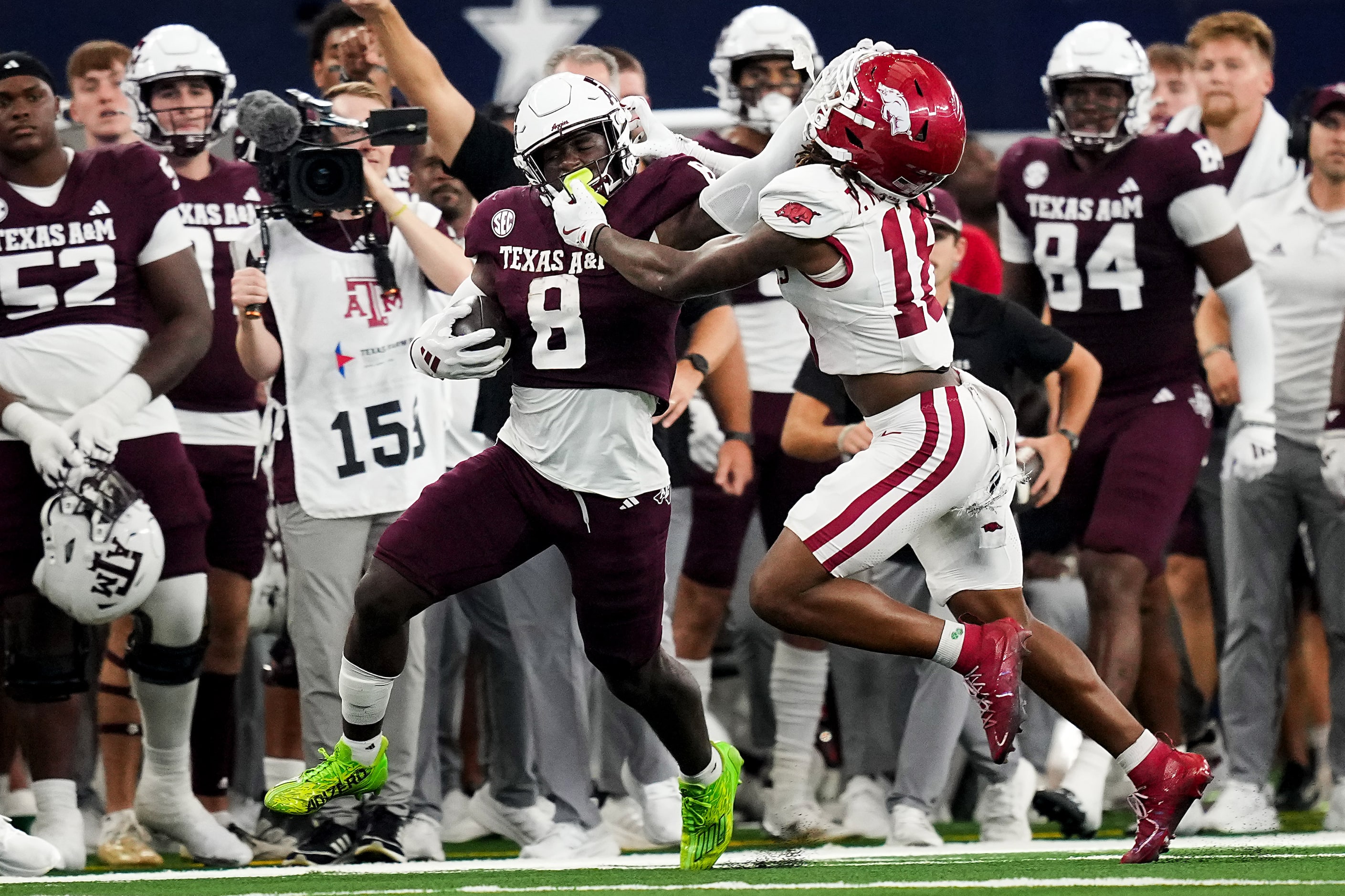 Texas A&M running back Le'Veon Moss (8) picks up a first down as he is pushed out of bounds...