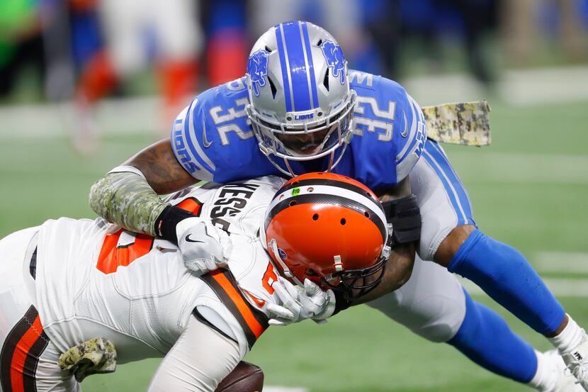 Detroit Lions strong safety Tavon Wilson (32) sacks Cleveland Browns quarterback Cody...