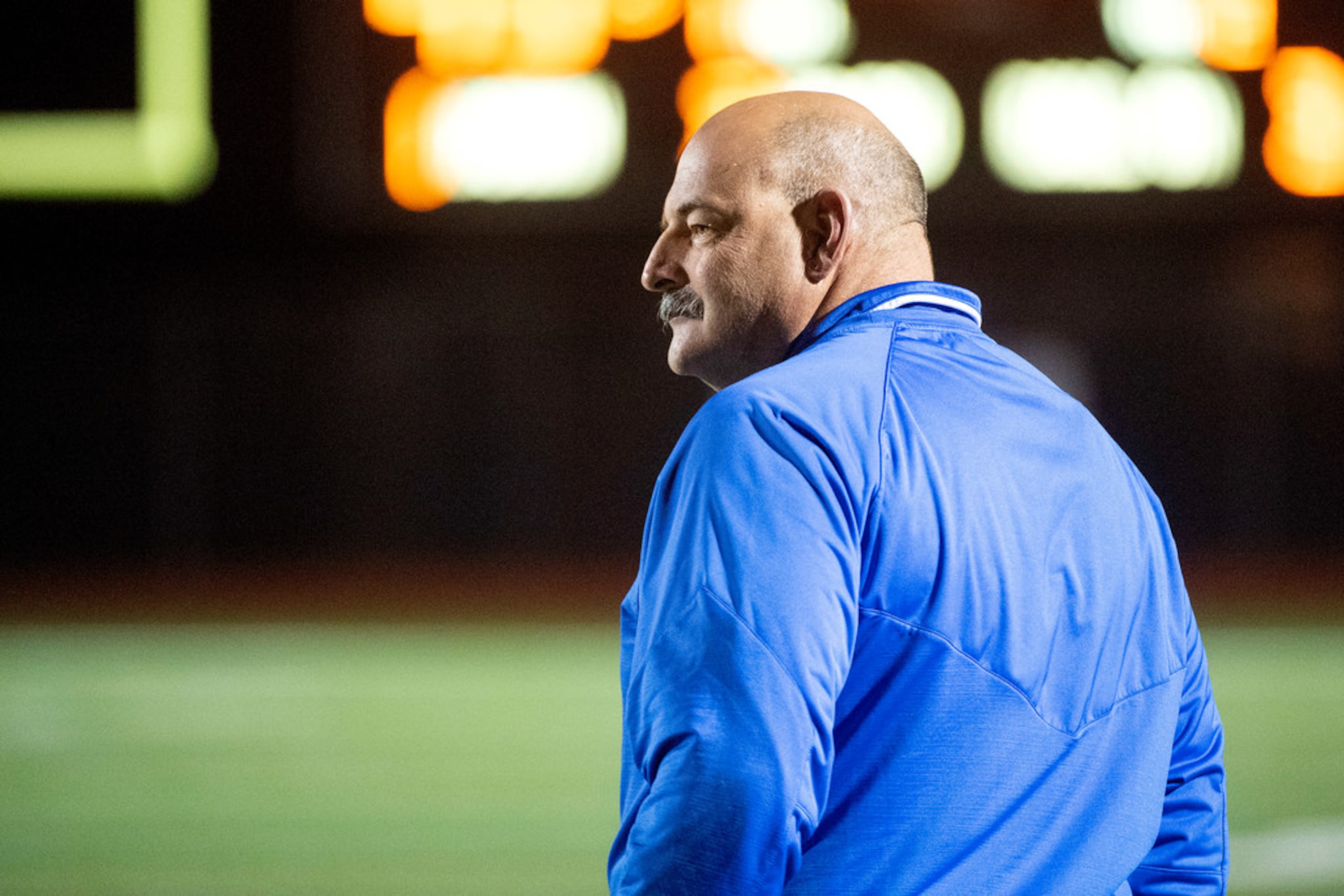 Hebron head coach Brian Brazil watches play during the second half of a high school football...