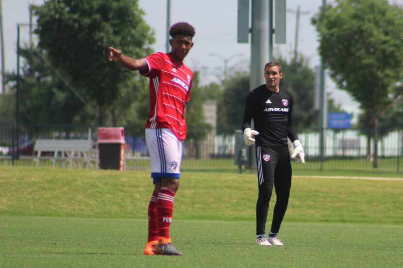 Chris Richards directs traffic against Tigres as Kyle Zobeck looks on.