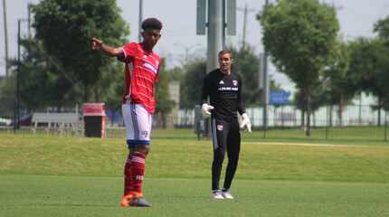 Chris Richards (left) directs traffic against Tigres as Kyle Zobeck looks on.