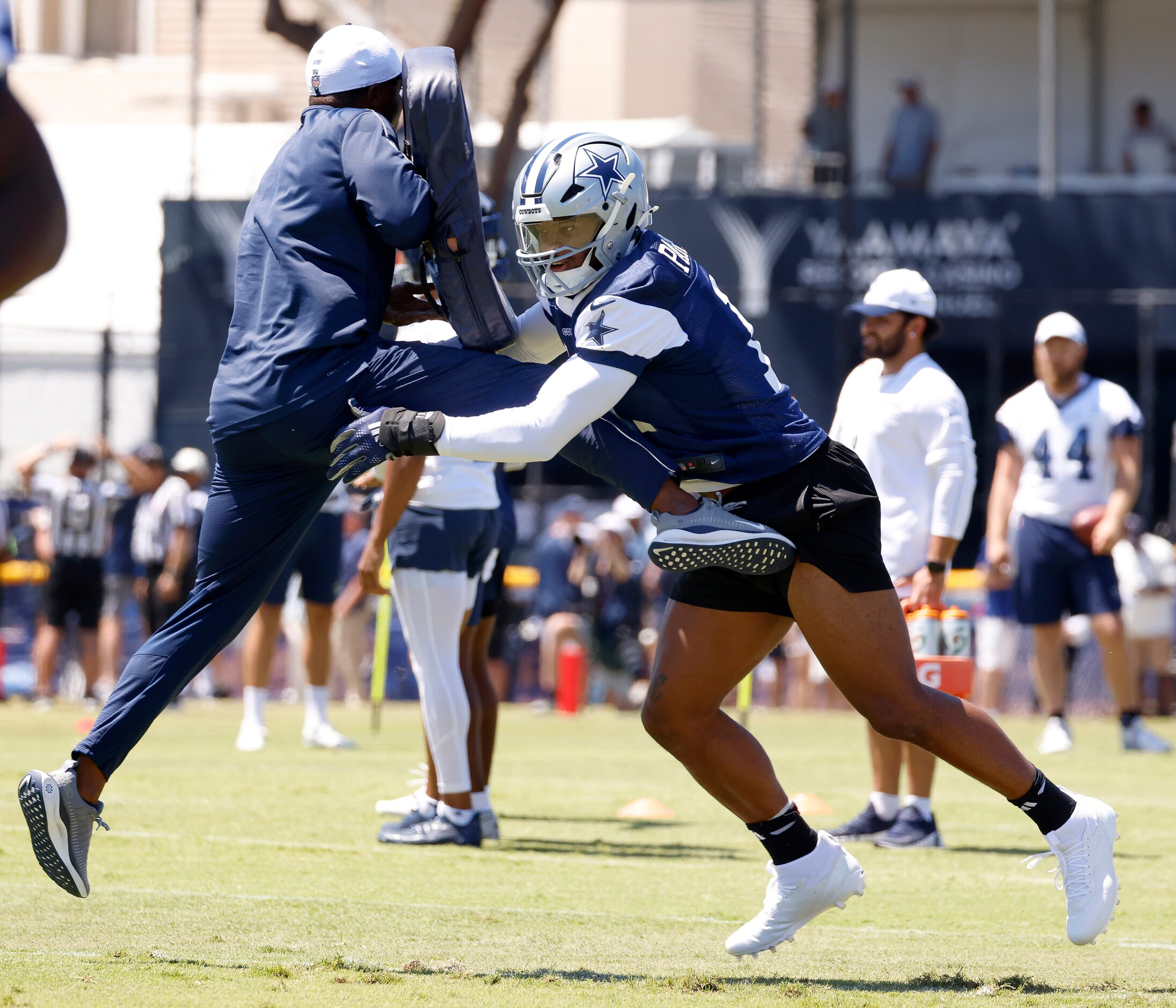 Dallas Cowboys linebacker Micah Parsons (11) launches a coach as the defense worked on...