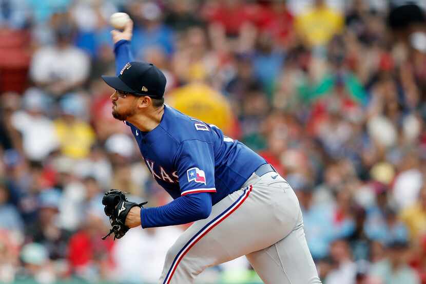 Texas Rangers' Dane Dunning pitches against the Boston Red Sox during the first inning of a...