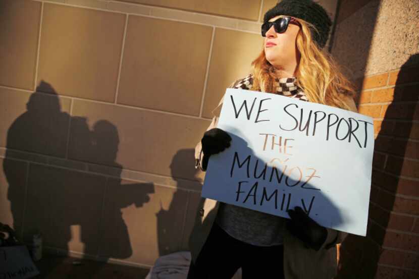 Autumn Brackeen of Fort Worth showed her support for the Muñoz family outside the Tim Curry...