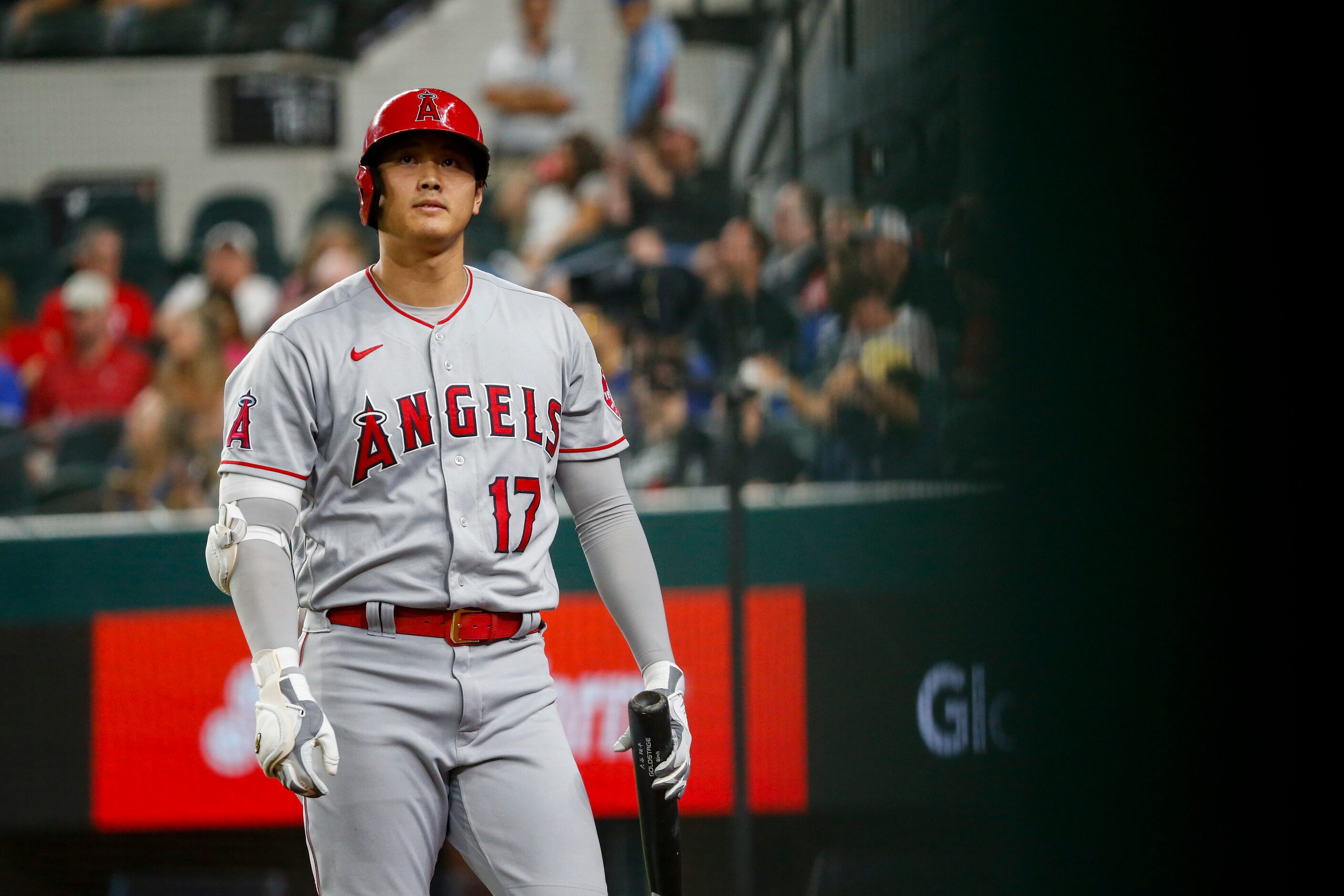 Los Angeles Angels designated hitter Shohei Ohtani (17) walks off the field after striking...