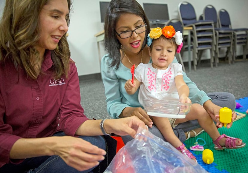 
Sandra Cantu (left), a parent educator with the Department of Family and Community...