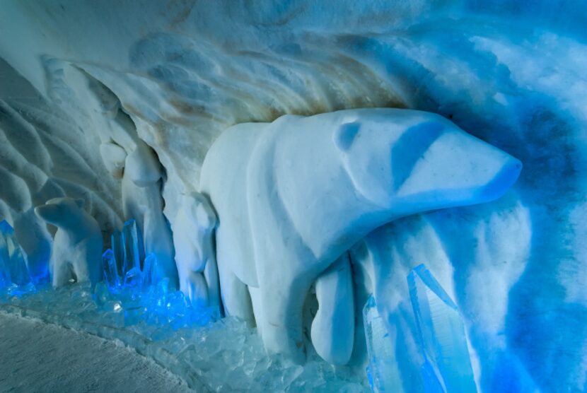 Bas-relief bears decorate a theme suite at Hôtel de Glace.  While outside temperatures may...