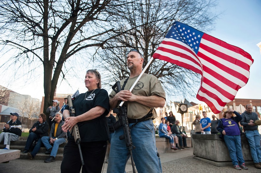 National Rifle Association instructor Marilyn Boulet, left, and her husband, Bill Perkins,...