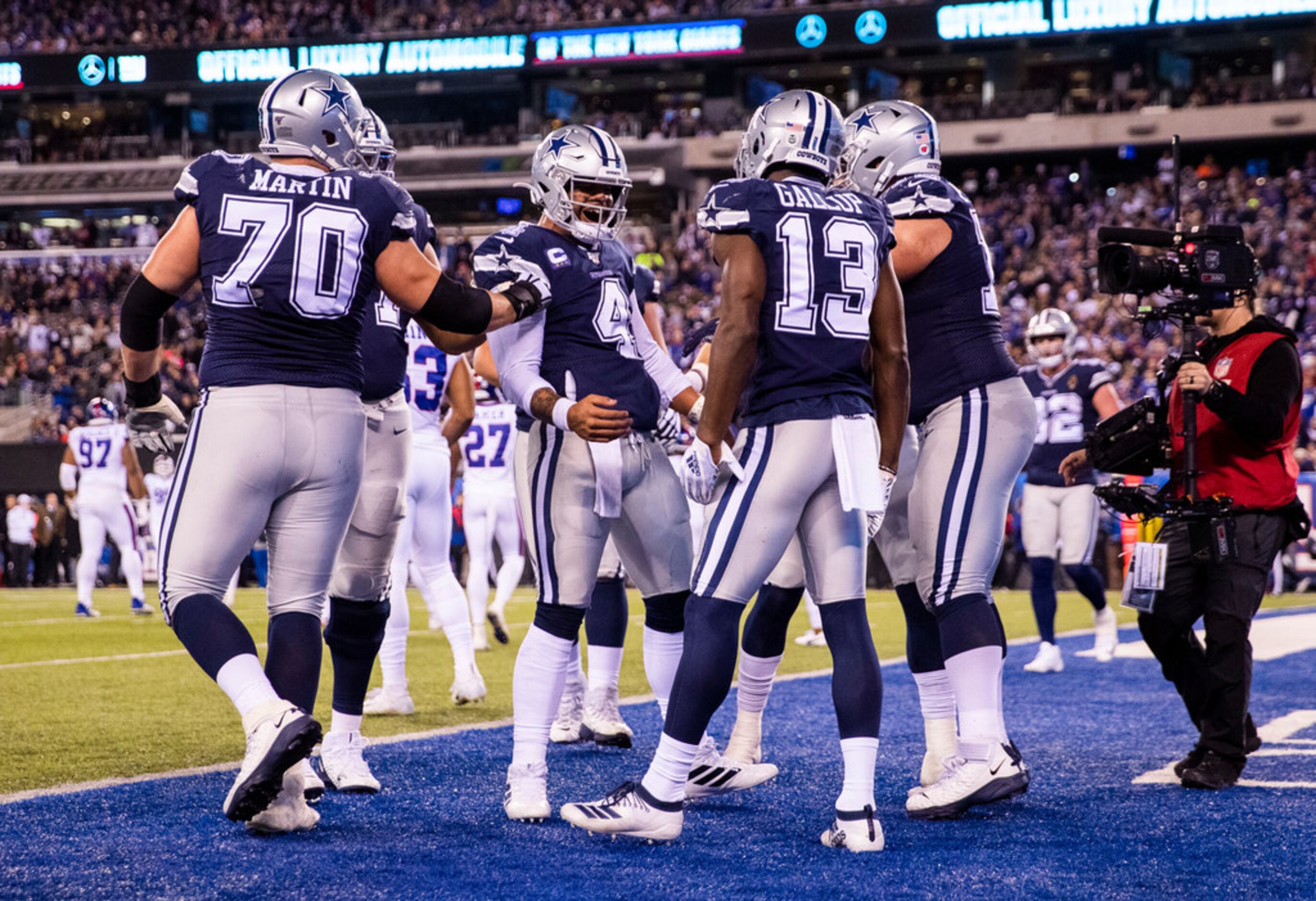Dallas Cowboys wide receiver Michael Gallup (13) celebrates a touchdown with quarterback Dak...
