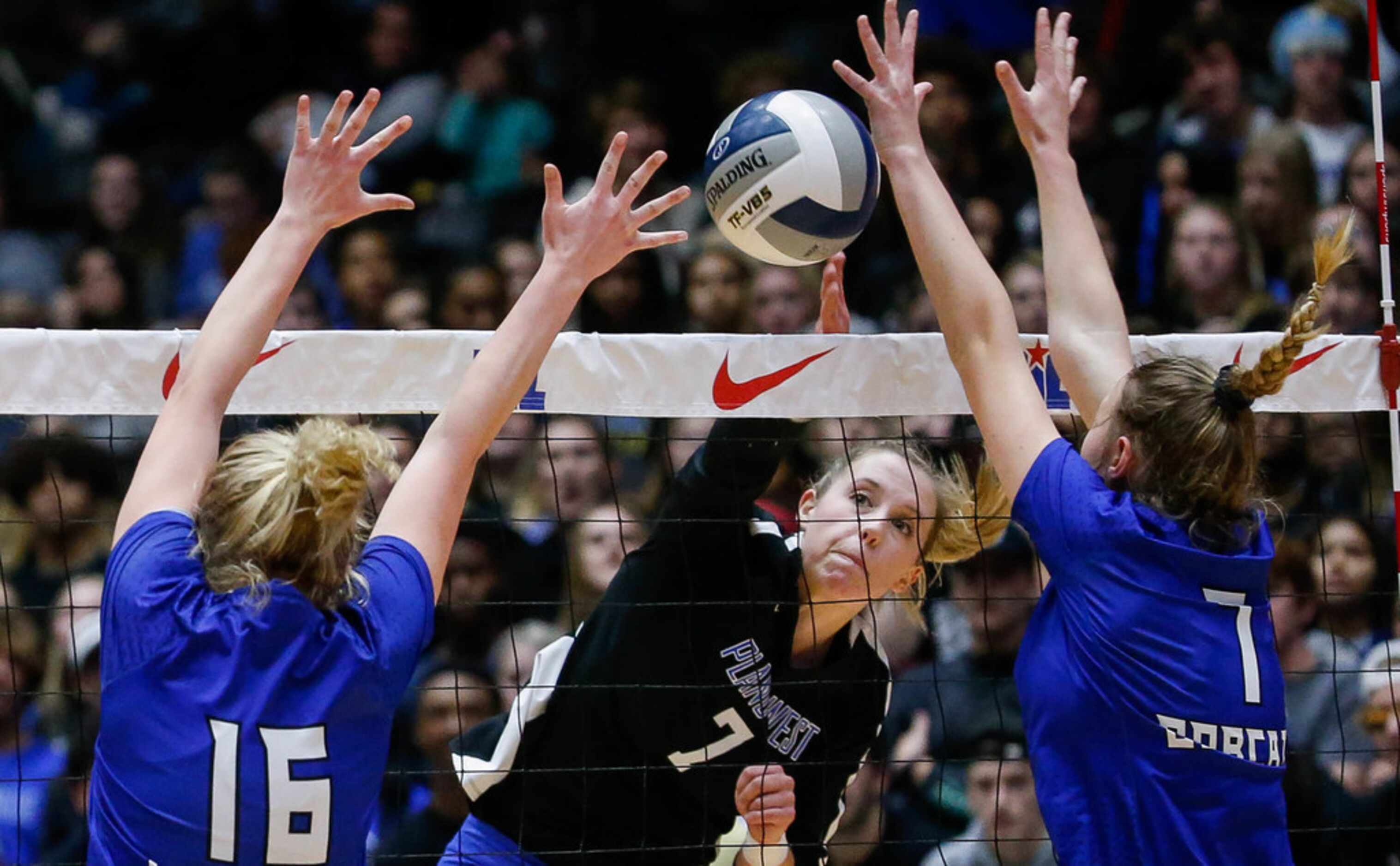 Plano WestÃs Jill Pressly (7) tips the ball over the net in the second set of a class 6A...