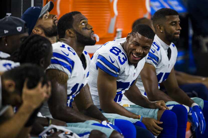Dallas Cowboys wide receiver Terrance Williams (83) jokes on the sidelines during the third...