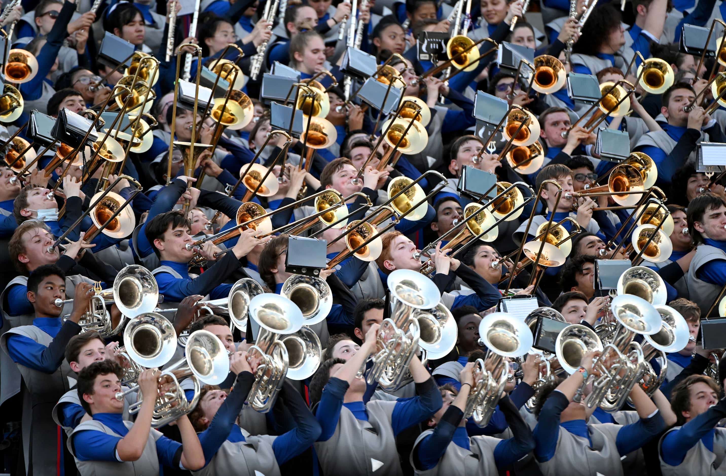 The Allen Escadrille performs in the stands during a high school football game between Plano...