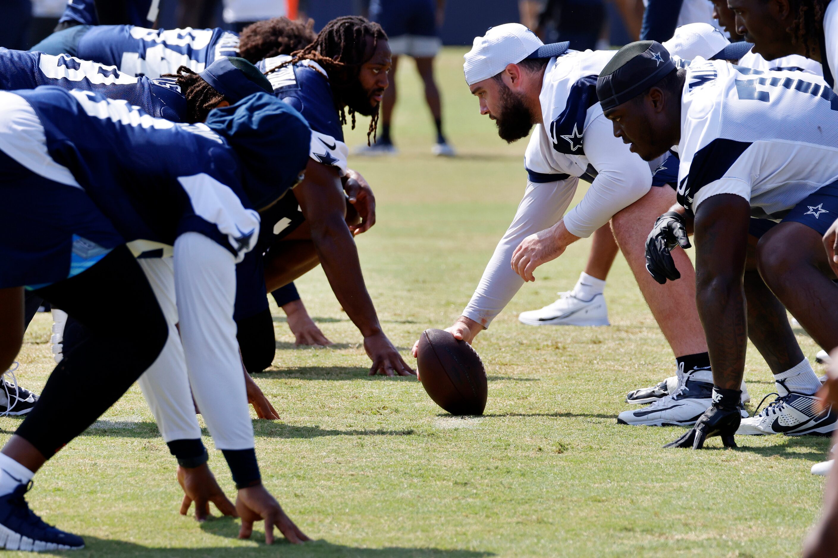 Dallas Cowboys center Brock Hoffman (67) waits to snap the football during a mock game walk...