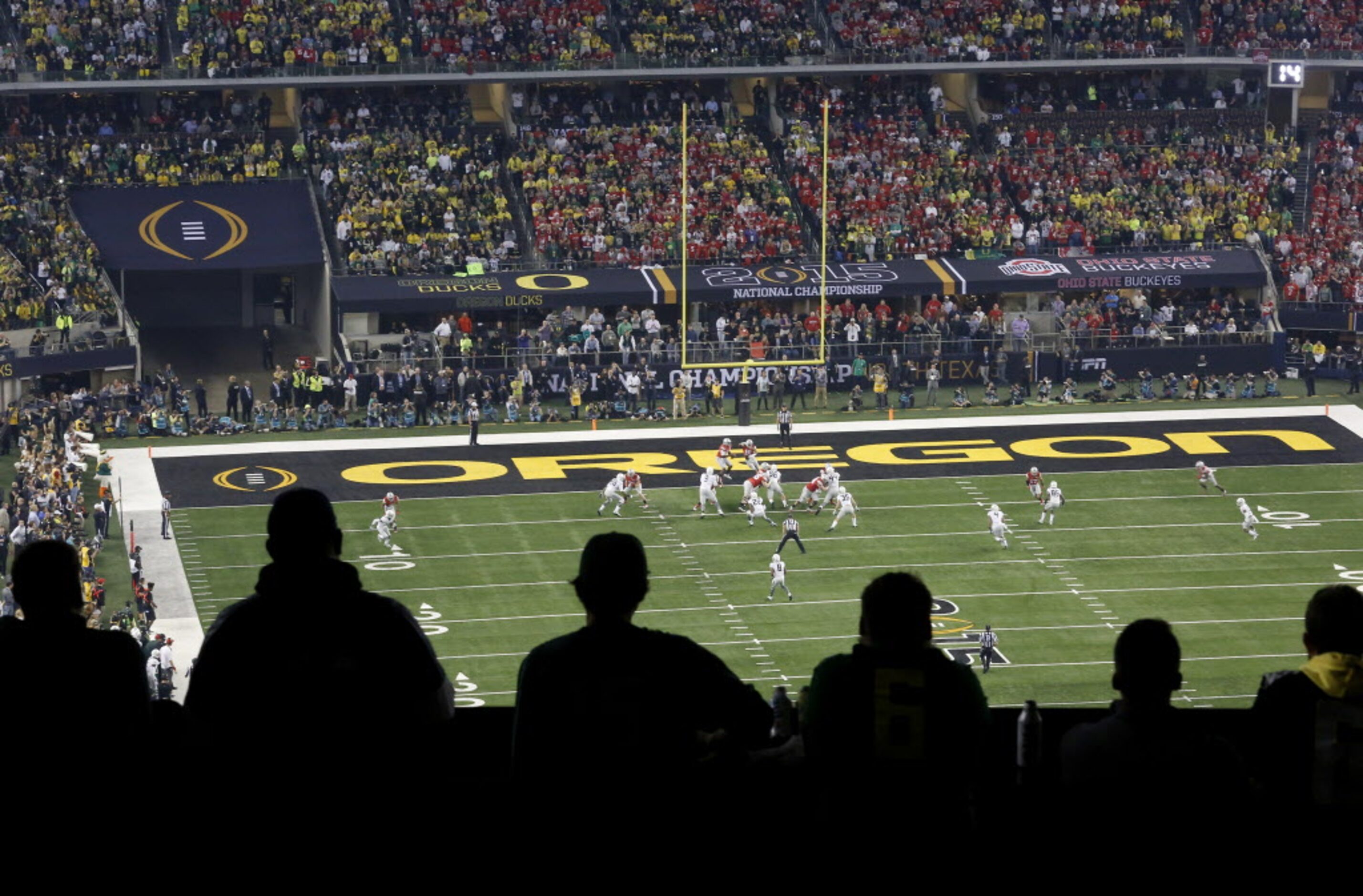 Fans watch play in the first half during the College Football Playoff National Championship...