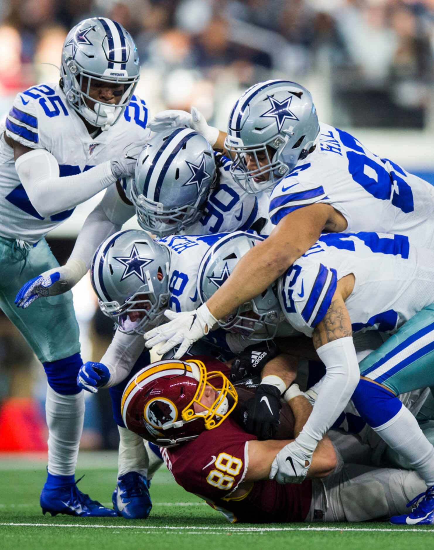 Washington Redskins tight end Hale Hentges (88) is tackled by Dallas Cowboys defenders...