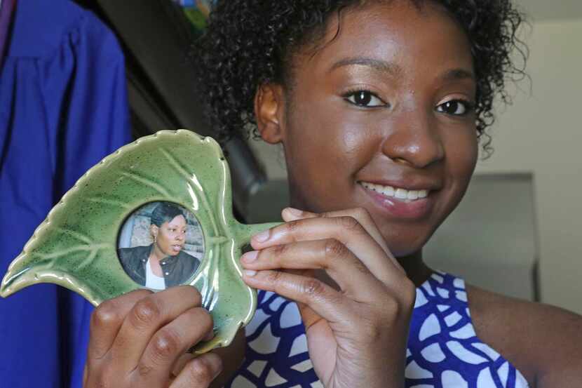 
Keyle Williams holds a portrait of her mother, the late Sibil Faith Dancer, in her Garland...