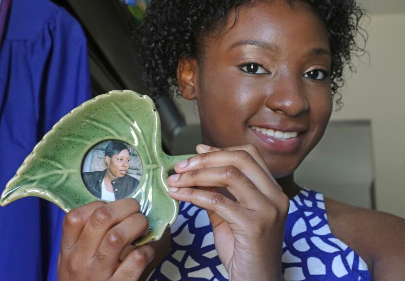 
Keyle Williams holds a portrait of her mother, the late Sibil Faith Dancer, in her Garland...