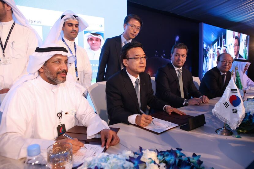  Kuwaiti National Petroleum Company CEO Mohammad al-Mutairi (Left) signs contracts during a...