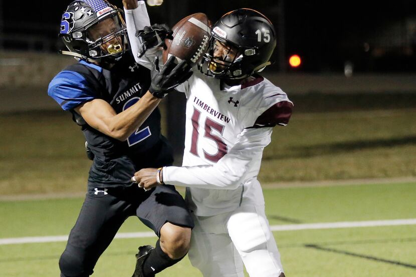 Mansfield Timberview senior defensive back Bryce Harris (15) blocks a pass intended for...
