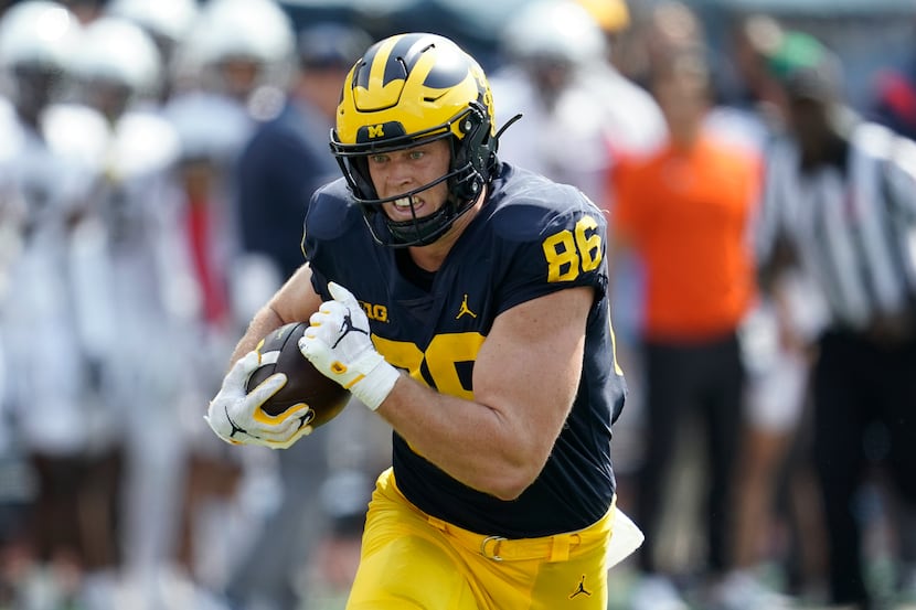 Michigan tight end Luke Schoonmaker (86) runs after a catch against Connecticut in the first...