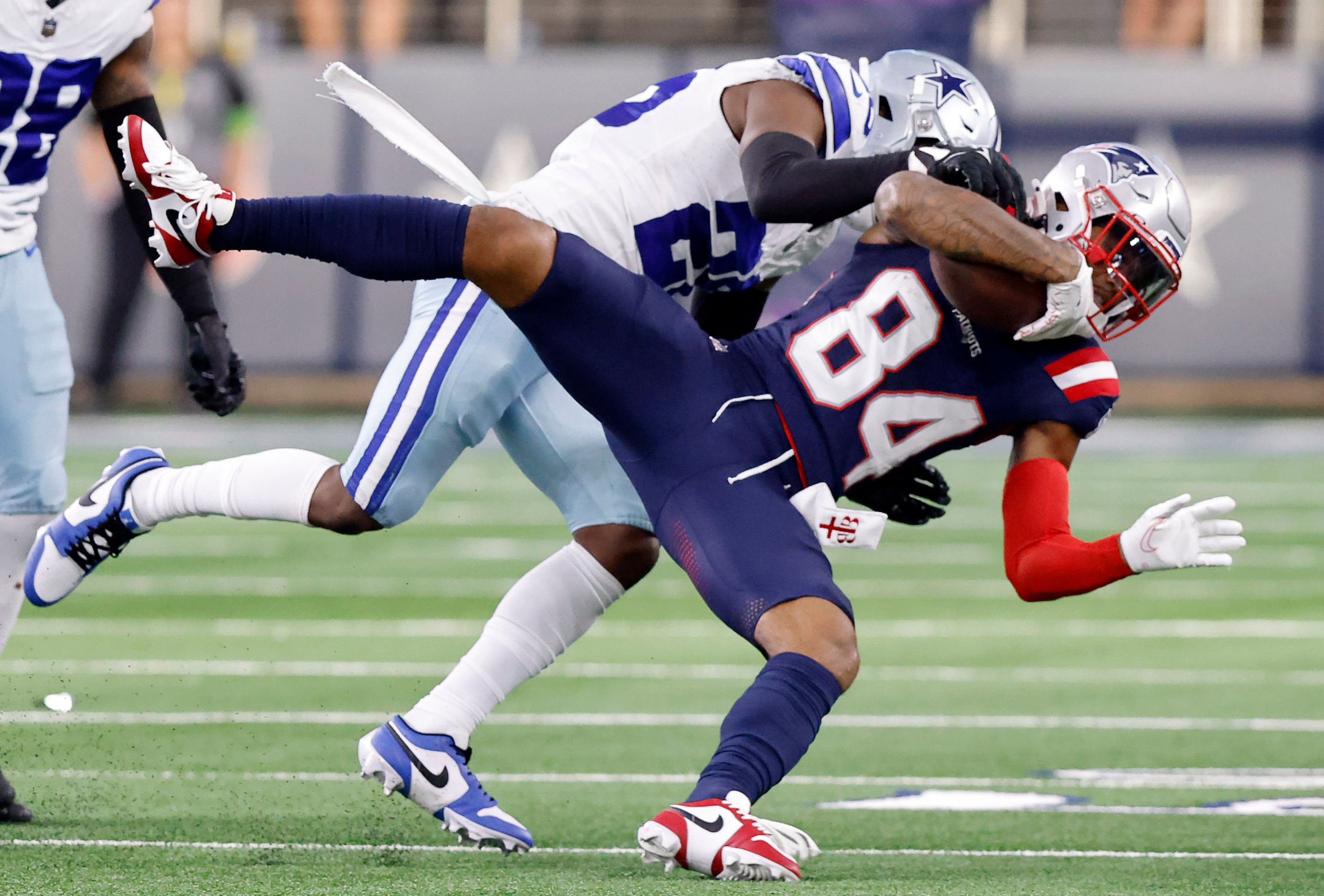 Dallas Cowboys cornerback DaRon Bland (26) spins and throws New England Patriots wide...