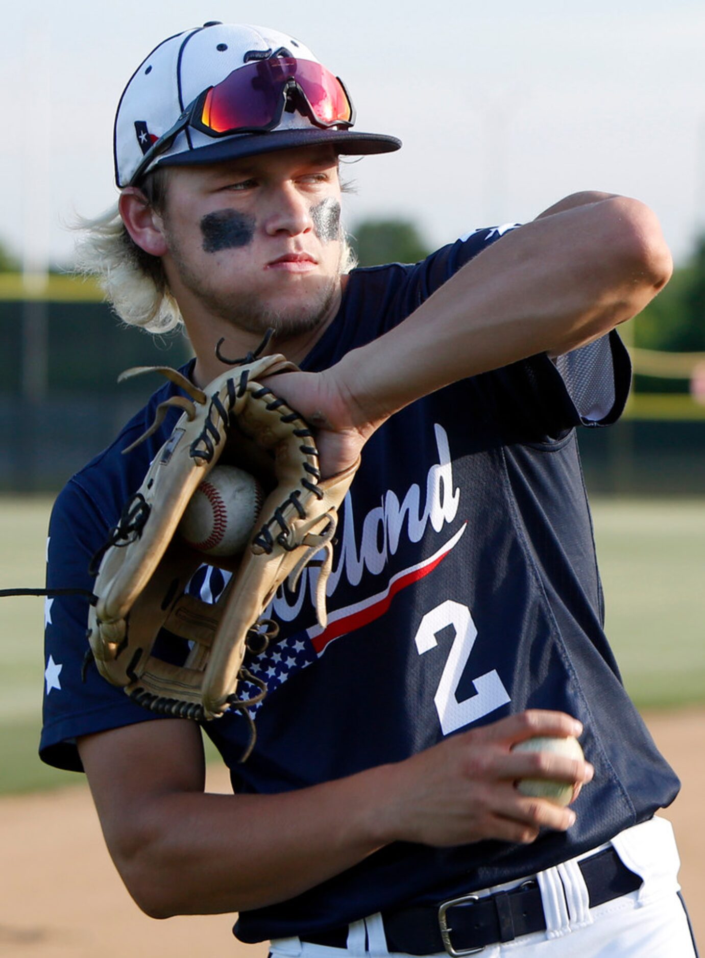 Richland's Kevin Garcia (2) warms up with a teammate prior to the start of their game...