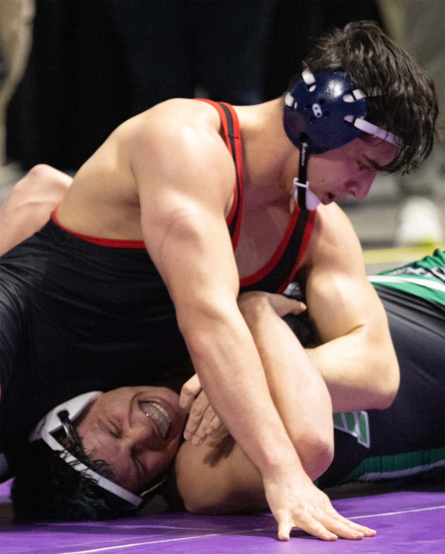 Ryan Nichols from Allen (top) wrestles Jose Angel Rosales in the 6A boys 215 pound division...