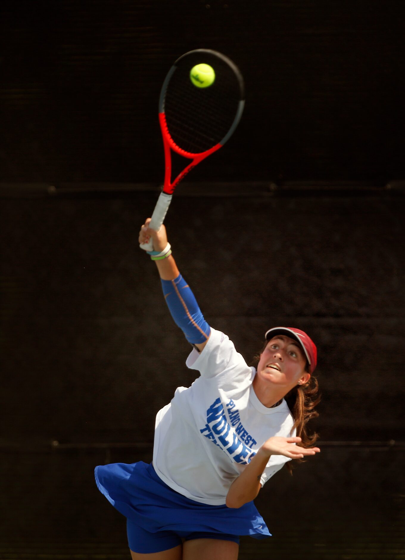 In a 6A girls singles match, Plano West's Natasha Opaciuch serves. UIL state tennis...