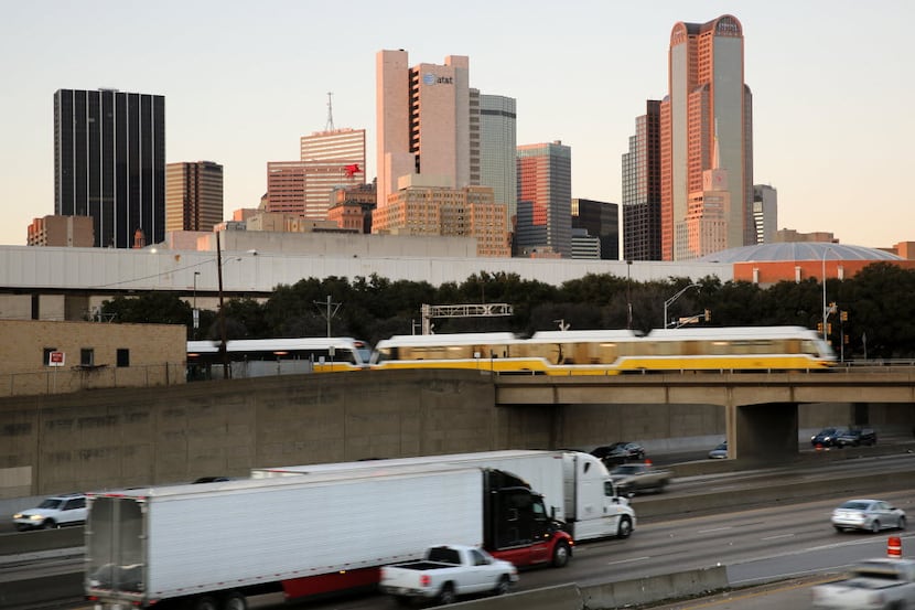 A DART train passes over Interstate 30 in the downtown Dallas canyon. DART wants to add a...