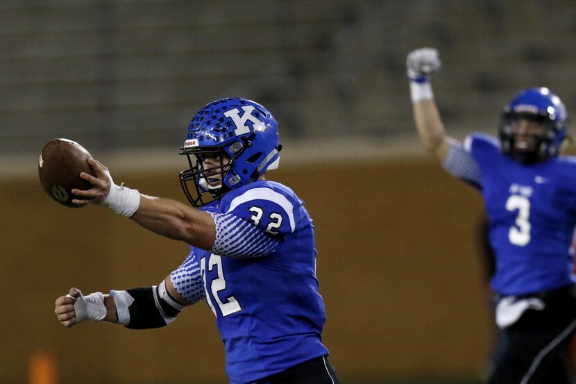 Krum's Coleton Spradley displays the ball after Krum's interception in the 1st half as...