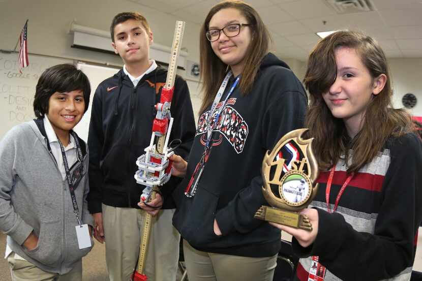 Bessie Coleman Middle School students Kevin Sulco (from left), Brandon Blanco, Carah Allen...