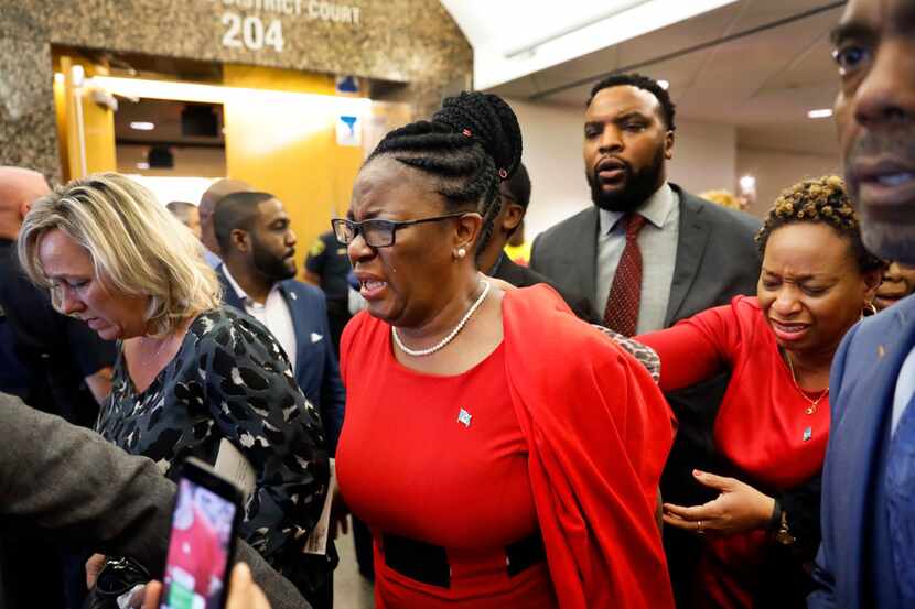 Botham Jean's mother, Allison, leaves the 204th District Court after fired Dallas police...