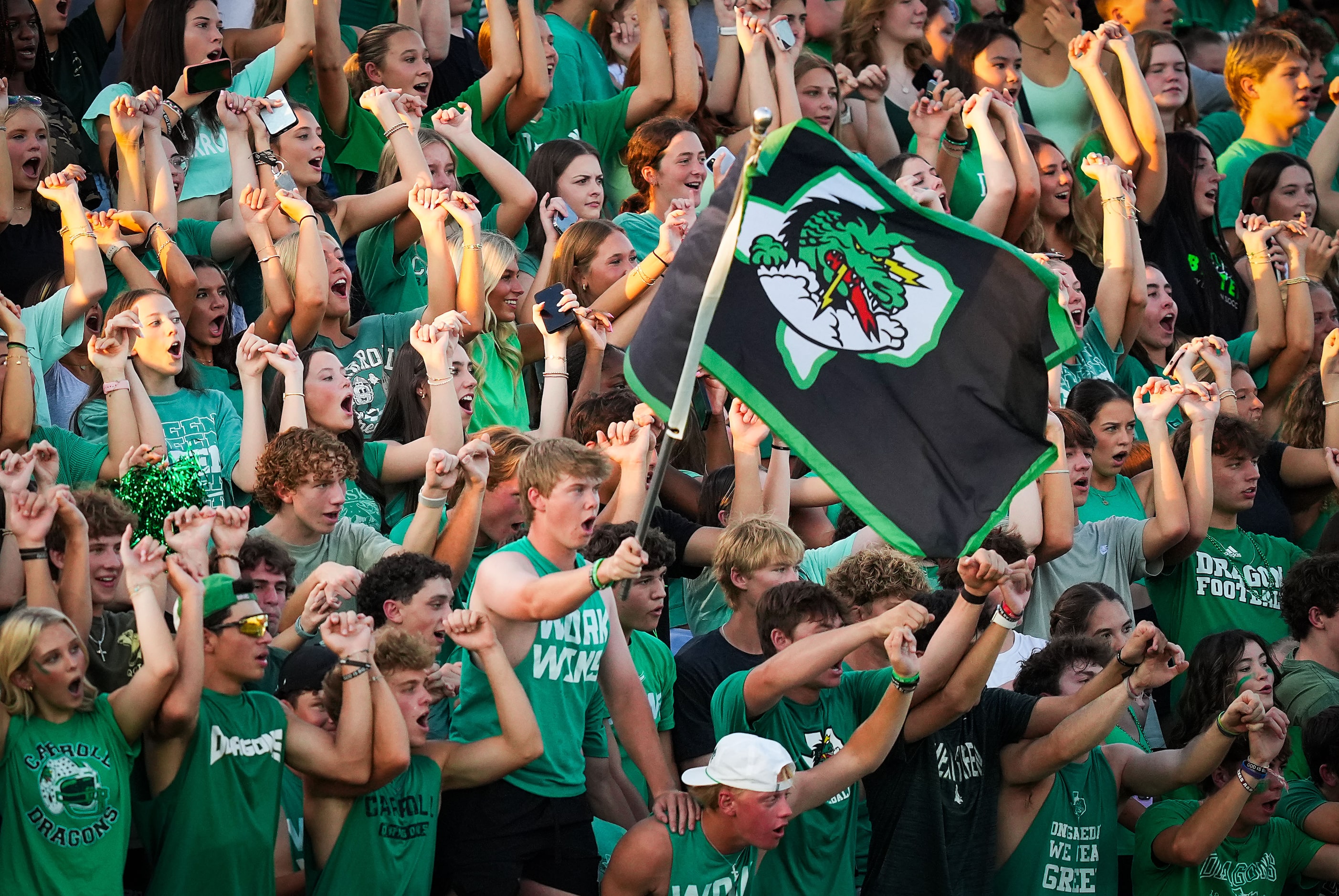 Southlake Carroll fans cheer during a kickoff during the first half of a District 4-6A high...