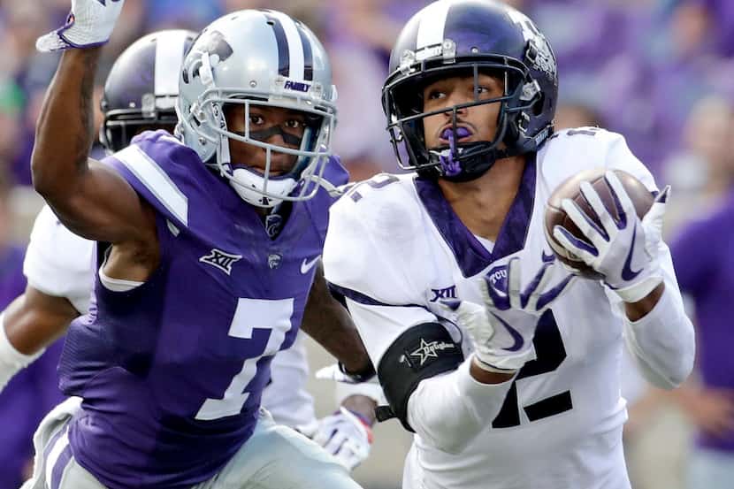 TCU safety Niko Small (2) breaks up a pass intended for Kansas State wide receiver Isaiah...