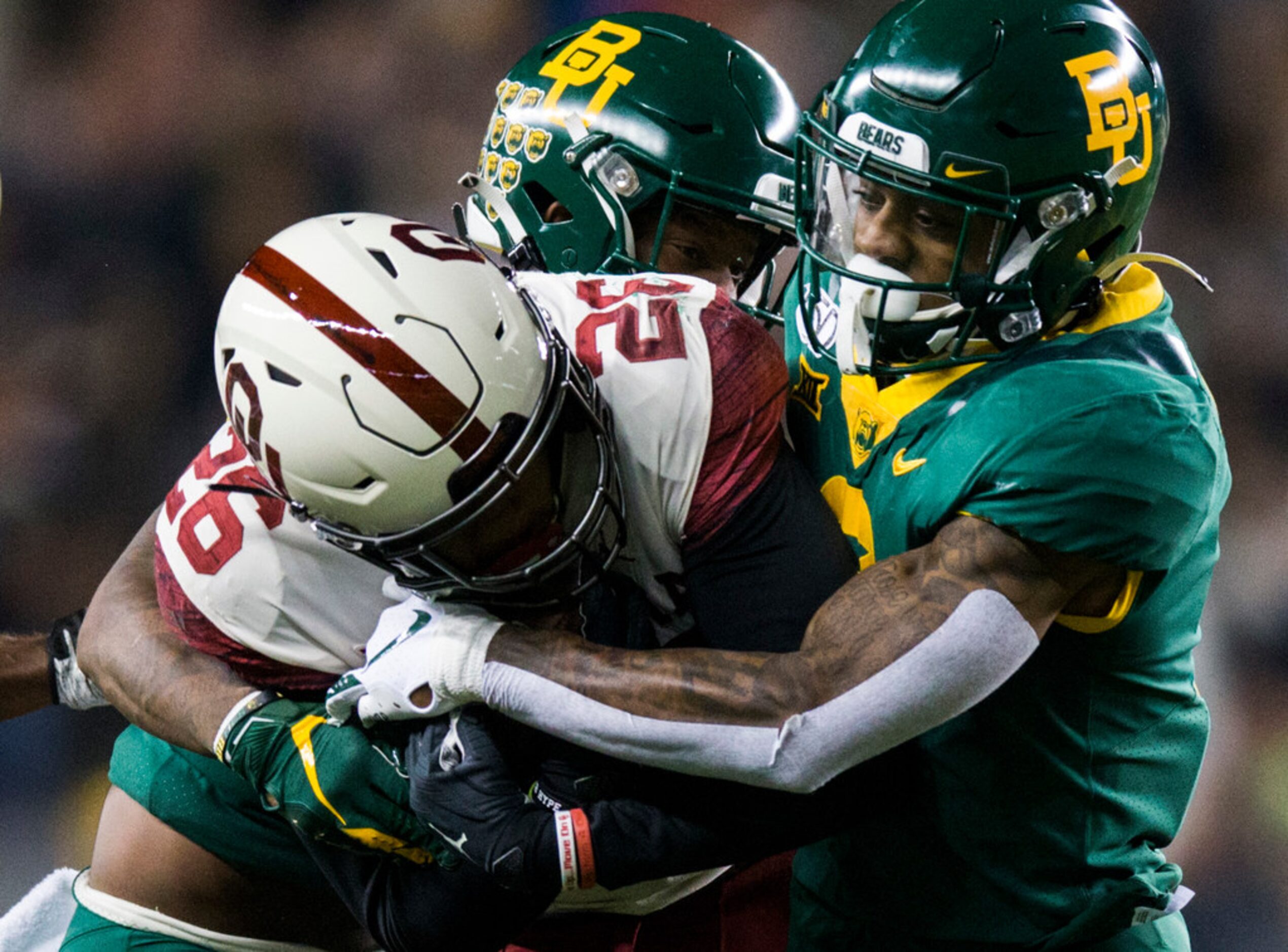 Baylor Bears cornerback Grayland Arnold (1) and safety Chris Miller (3) tackle Oklahoma...