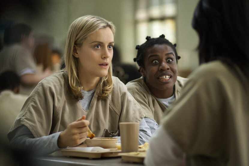  Taylor Schilling, left, and Uzo Aduba in a scene from "Orange Is the New Black." Season 2.