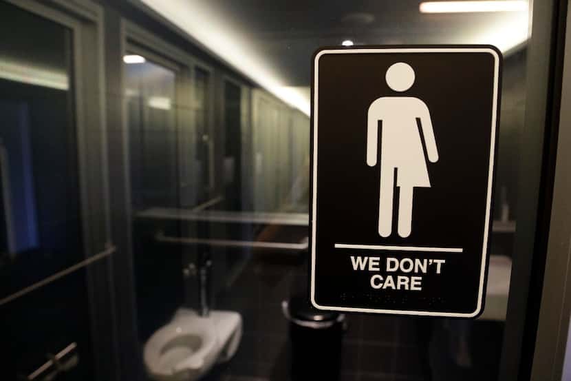 In this May 12, 2016 file photo, signage is seen outside a restroom at 21c Museum Hotel in...