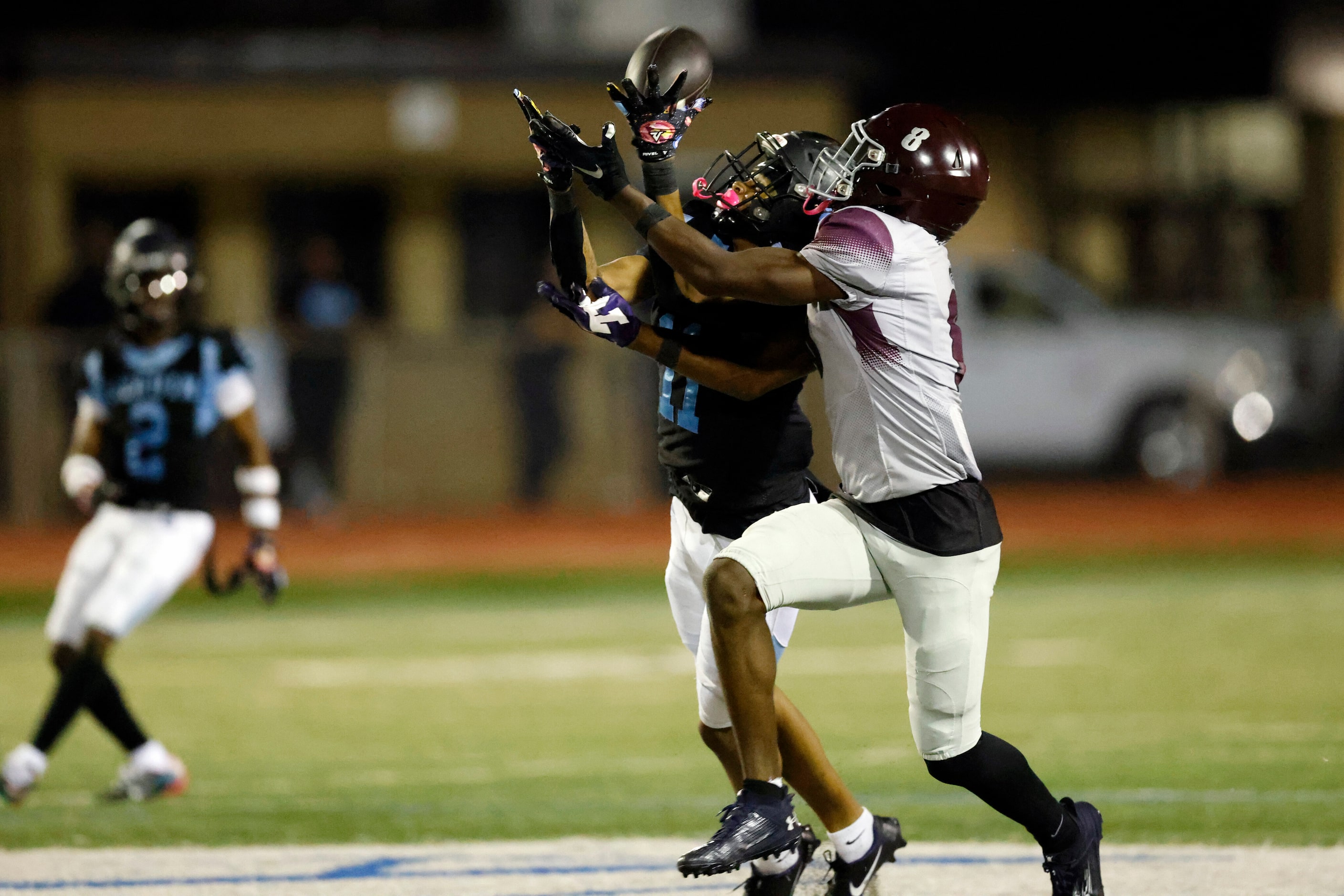 Arlington Seguin wide receiver Carterrious Brown (11) hauls in a pass ahead of Mansfield...